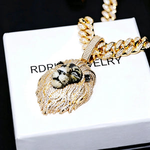 Gold iced out 3D enamel painted lion king pendant side angle shot, realistic hand‑painted lion facial details, vvs simulated diamond covered mane and bail, paired with iced cuban link chain, premium men hip hop jewelry displayed on branded gift box RDRIP JEWELRY
