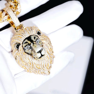 Closeup view of gold iced out 3D enamel painted lion king pendant held in white cotton gloves, detailed realistic hand‑painted lion face, fully encrusted vvs simulated diamonds on mane and bail, luxury men hip hop statement pendant jewelry RDRIP JEWELRY
