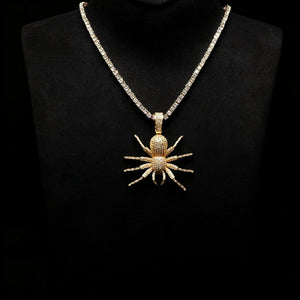 Gold Iced Tarantula Spider Pendant with tennis chain on black mannequin bust display, fully micro paved VVS simulated diamonds hip hop necklace for men, wearable street style bling jewelry presentation RDRIP JEWELRY
