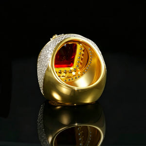 Inner cavity back‑view studio product photo of two‑tone 18k gold plated heavy men hip‑hop champion ring, view of polished smooth gold inner band and hollow perforated setting base, large rectangular red ruby gemstone seen from ring interior, outer band fully encrusted with hand‑set micro pave cubic zirconia stones, thick bulky iced‑out hip‑hop jewelry design, shot on glossy black mirror reflective surface, dark solid background, premium collectible rapper statement ring RDRIP JEWELRY
