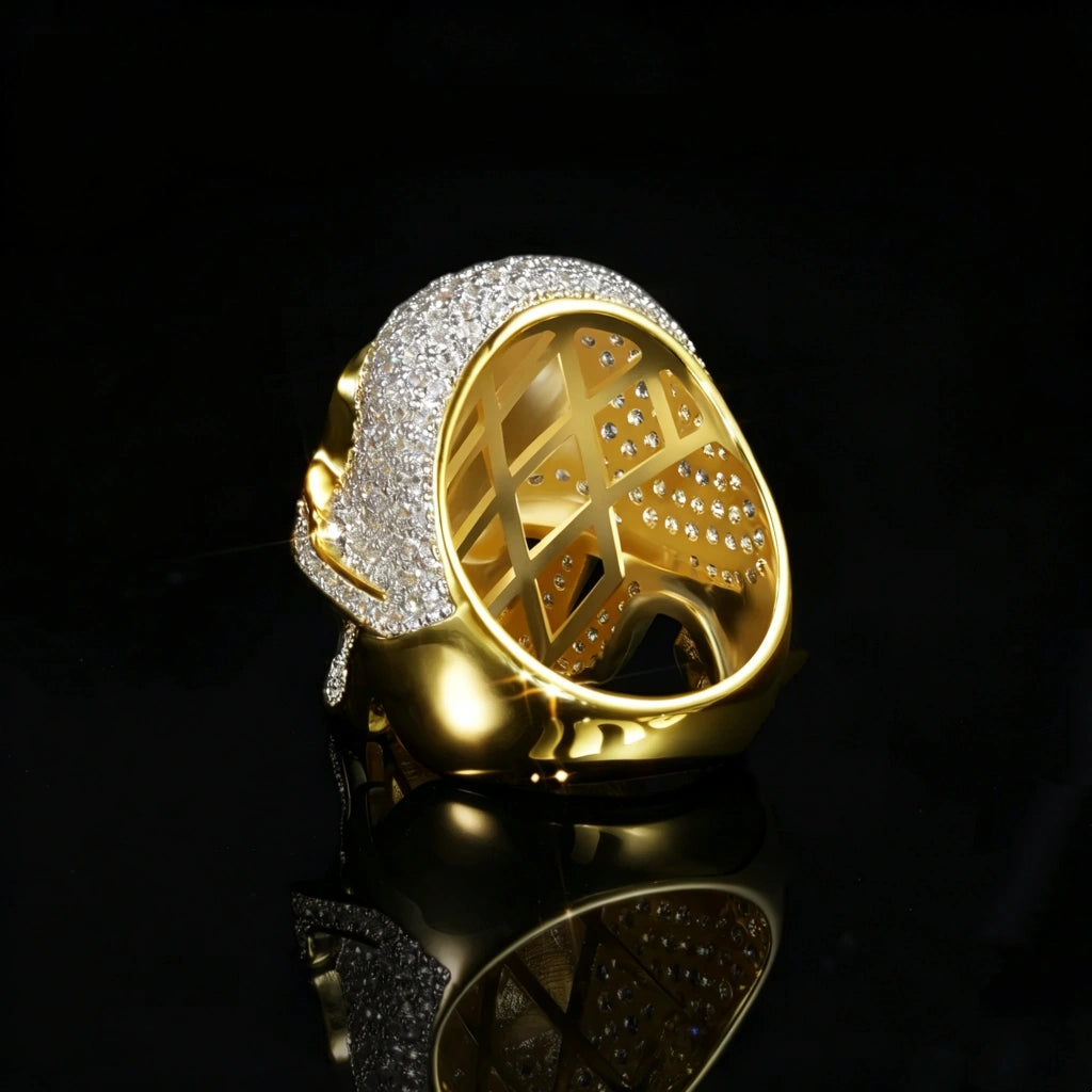 Back inner hollow view of two tone 3D iced out skull ring for men, open lattice hollow back structure, micro pave cubic zirconia stones, 18k gold plated copper hip hop bling ring, black reflective studio background RDRIP JEWELRY
