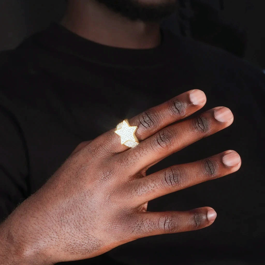 Men hand model wearing gold plated iced out pentagram wide‑band hip‑hop ring full micro paved cubic zirconia stones, real‑wear showcase of icy star bling statement jewelry for street fashion and rap style RDRIP JEWELRY