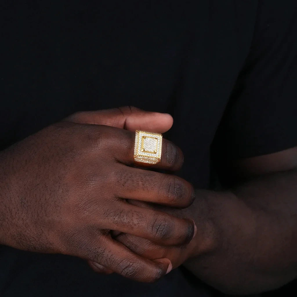 Official Limited micro‑inlay multi‑layer square signet ring hand worn model shot,18K gold plated heavy‑weight men hip‑hop ring,full pave sparkling cubic zirconia micro‑inlay stones,multi‑layer square frame iced‑out wide band ring,real‑life wearing effect,men rapper statement fashion jewelry against dark black background RDRIP JEWELRY
