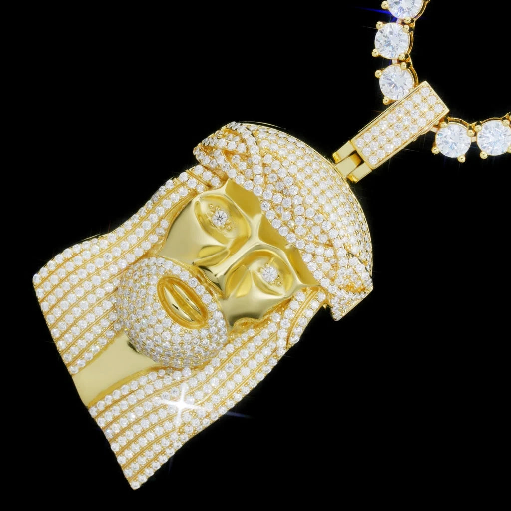 rdrip jewelry 925 sterling silver d color vvs1 plus moissanite iced out jesus piece pendant gold plated diagonal sparkle view paired with round moissanite tennis chain polished glossy golden metal face full pave moissanite crown of thorns textured beard and hair iced hinged bail heavy hip hop mens bling jewelry solid black background macro closeup product photo
