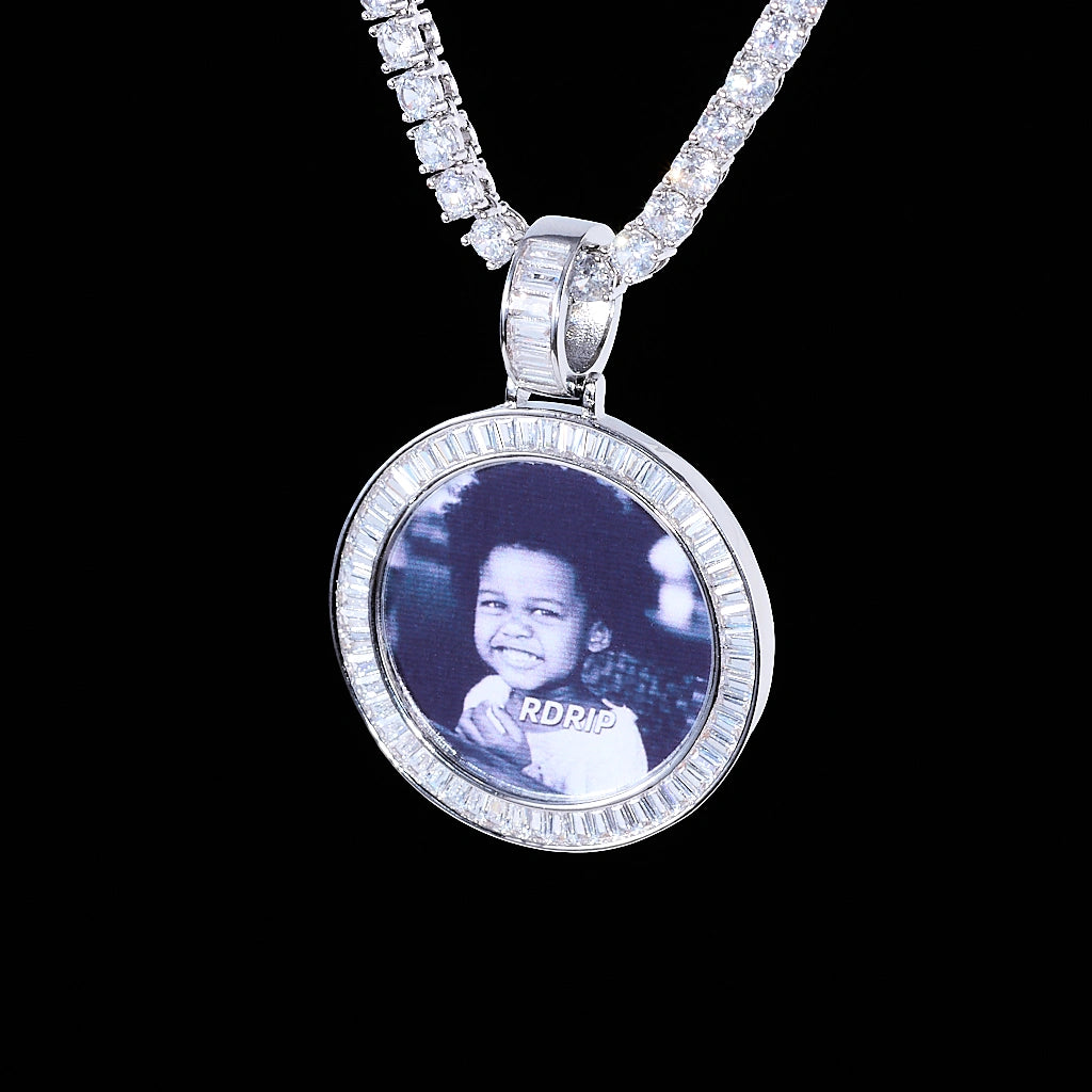 Baguette Iced Out Round Custom Photo Pendant Necklace, white gold tone pendant with baguette-cut stone frame, custom black-and-white child portrait photo, hanging tennis chain on solid black background, personalized hip hop memory jewelry, RDRIP JEWELRY
