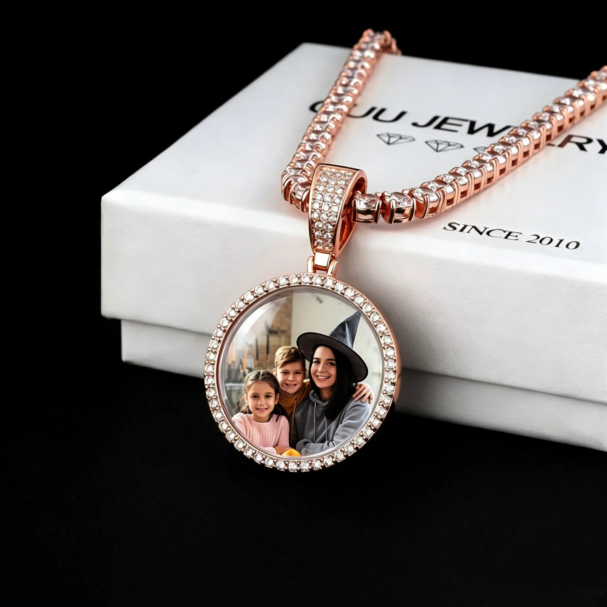 Classic Iced Out Circle Custom Photo Pendant Necklace, rose gold tone circular family portrait medallion with glass cover reflection, single row icy stone frame, tennis chain, displayed on white branded gift box, black background studio shot, personalized family keepsake hip hop jewelry, RDRIP JEWELRY
