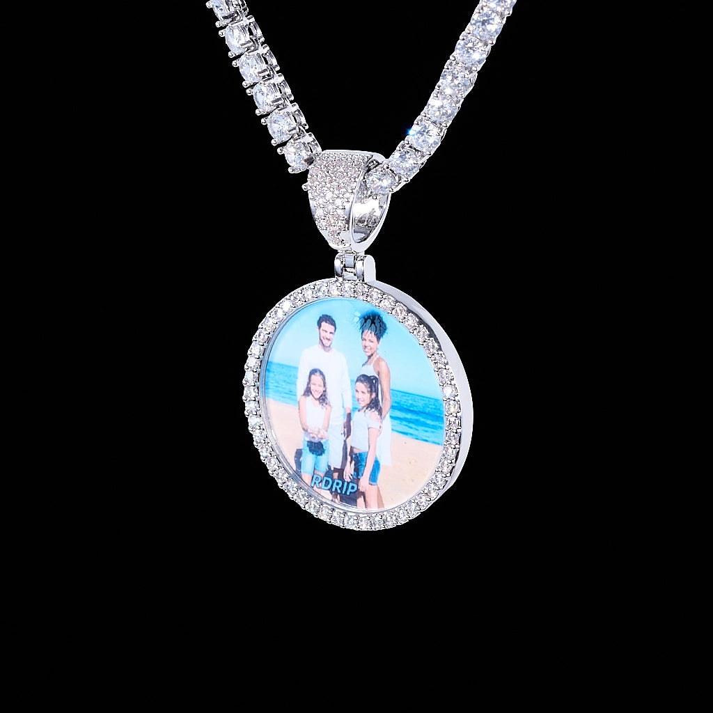 Classic Iced Out Circle Custom Photo Pendant Necklace, silver tone circular family photo medallion with single row stone frame, paired with tennis chain, studio shot on solid black background, personalized hip hop memory keepsake jewelry, RDRIP JEWELRY
