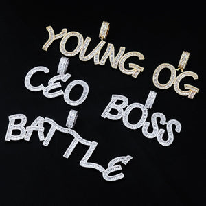Iced Out Baguette Custom Name Letter Pendant Necklace, flat lay collection shot, gold tone & white gold tone letter pendants including YOUNG, OG, CEO, BOSS, BATTLE, mixed baguette cut stones, solid black background, customizable hip hop personalized name jewelry, RDRIP JEWELRY
