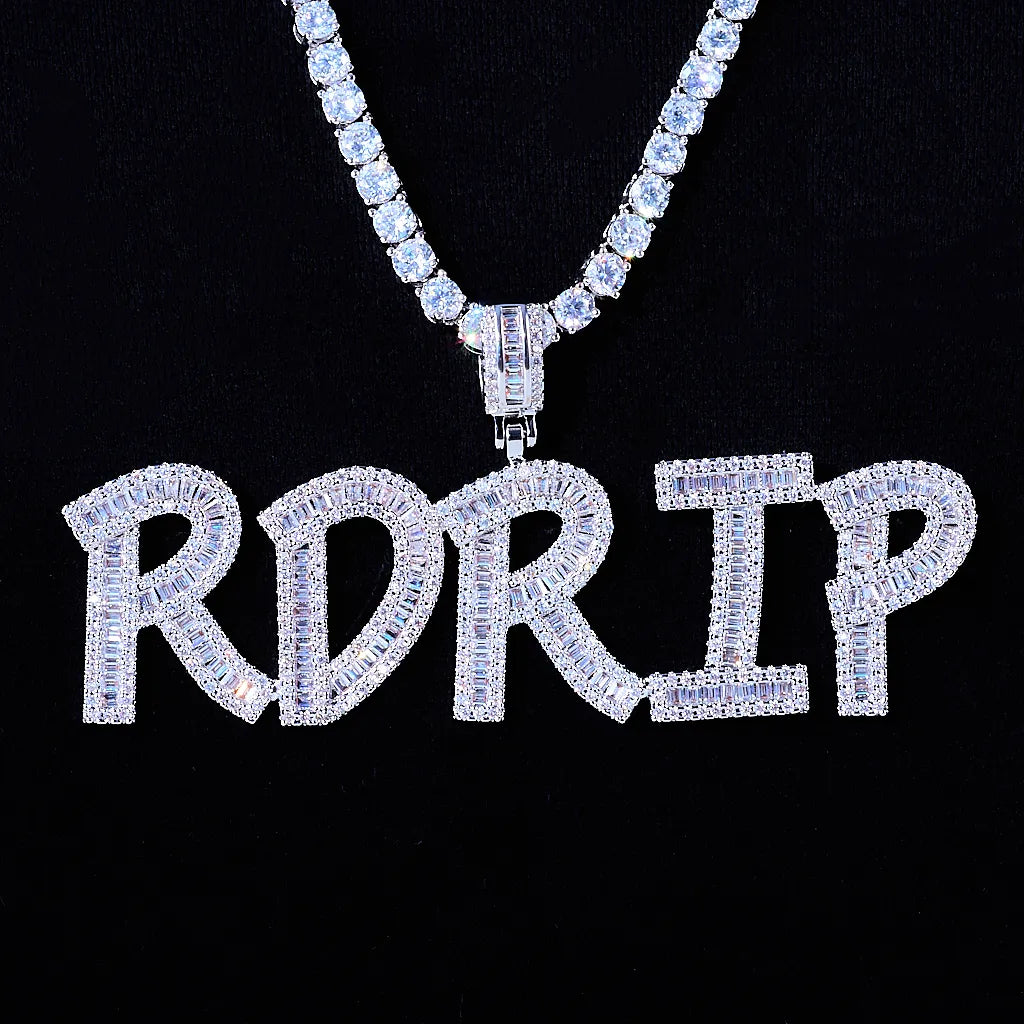Iced Out Baguette Custom Name Letter Pendant Necklace, white gold tone hanging front view, mixed baguette and round cut stones custom letter pendant spelling RDRIP, matched tennis chain, solid black background, personalized hip hop custom name jewelry, RDRIP JEWELRY
