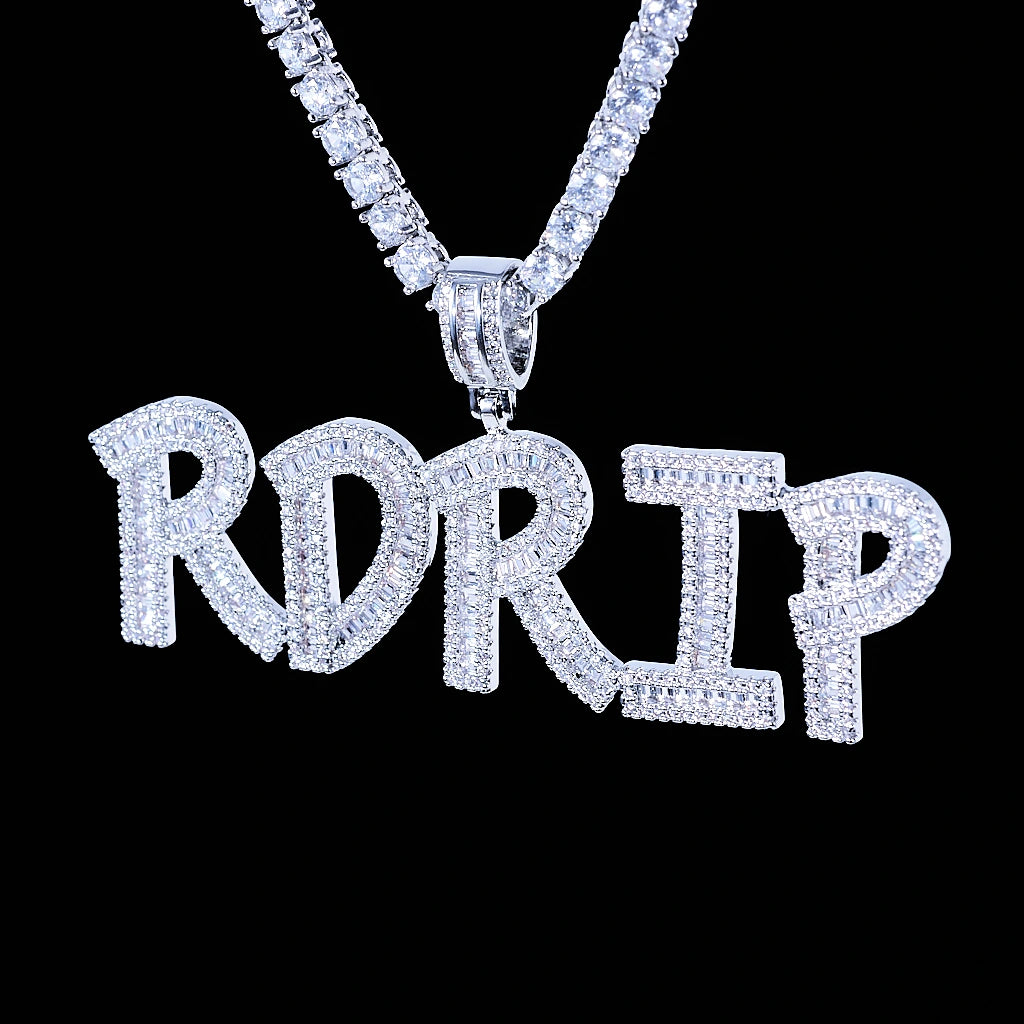 Iced Out Baguette Custom Name Letter Pendant Necklace, white gold tone hanging front view, mixed baguette and round cut stones custom letter pendant spelling RDRIP, matched tennis chain, solid black background, personalized hip hop custom name jewelry, RDRIP JEWELRY
