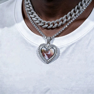 Iced Out Double Sided Rotatable Heart Custom Photo Pendant, silver tone layered with iced cuban link chain, worn on dark black skin model in plain white t-shirt, couple portrait inside heart locket frame, hip hop personalized custom photo necklace, RDRIP JEWELRY
