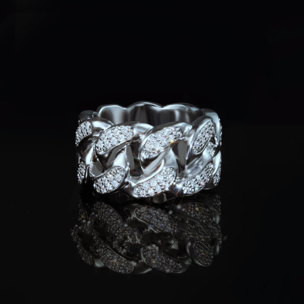 Front view of iced out silver tone miami cuban link men ring, thick wide hollow band with micro pave cubic zirconia stones, luxury hip hop bling statement ring displayed on black reflective surface with mirror reflection by RDRIP JEWELRY
