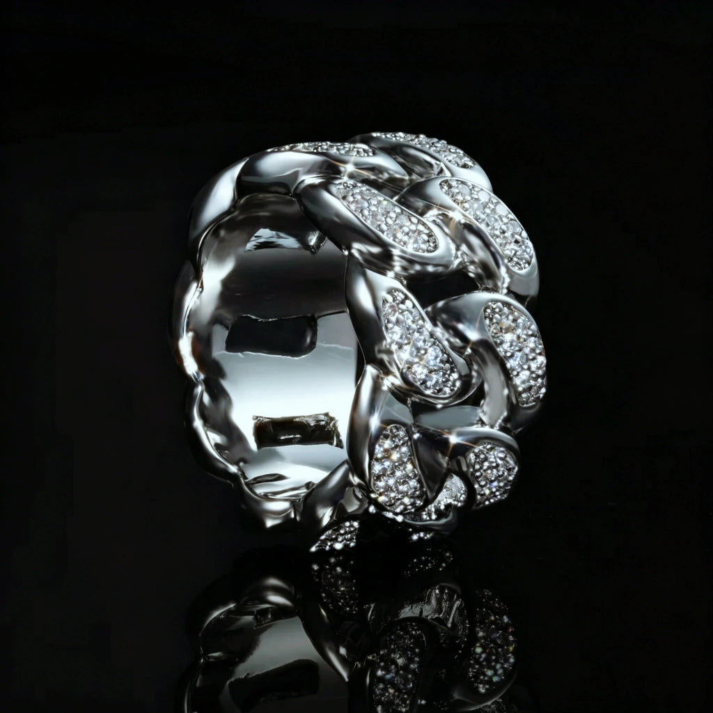 Side inner view of iced out silver tone miami cuban link men ring, micro pave cubic zirconia stones, thick hollow wide band hip hop statement jewelry, shot on black reflective background with mirror reflection effect by RDRIP JEWELRY
