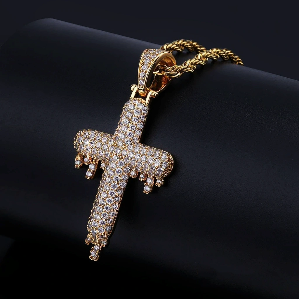 RDRIP JEWELRY SINCE 2016 18k gold plated Iced Out Dripping Cross Pendant close up studio product shot, fully micro paved cubic zirconia melting drip cross hip hop necklace with twisted rope chain, sparkling iced out men hip hop street fashion jewelry gold finish
