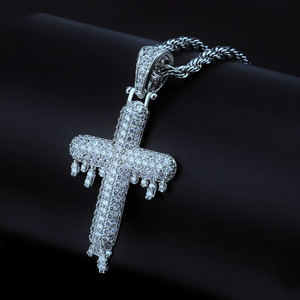 RDRIP JEWELRY SINCE 2016 Silver finish Iced Out Dripping Cross Pendant single piece studio detail shot, fully micro paved cubic zirconia melting drip cross hip hop necklace paired with silver twisted rope chain, shiny iced out mens streetwear hip hop jewelry silver tone
