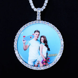 VVS MOISSANITE LARGE 3D CIRCLE CUSTOM PICTURE PENDANT, silver plated round custom memory couple portrait charm, iced out stone border personalized photo medallion hip hop jewelry matched with tennis chain, close-up product photo on black background, RDRIP JEWELRY
