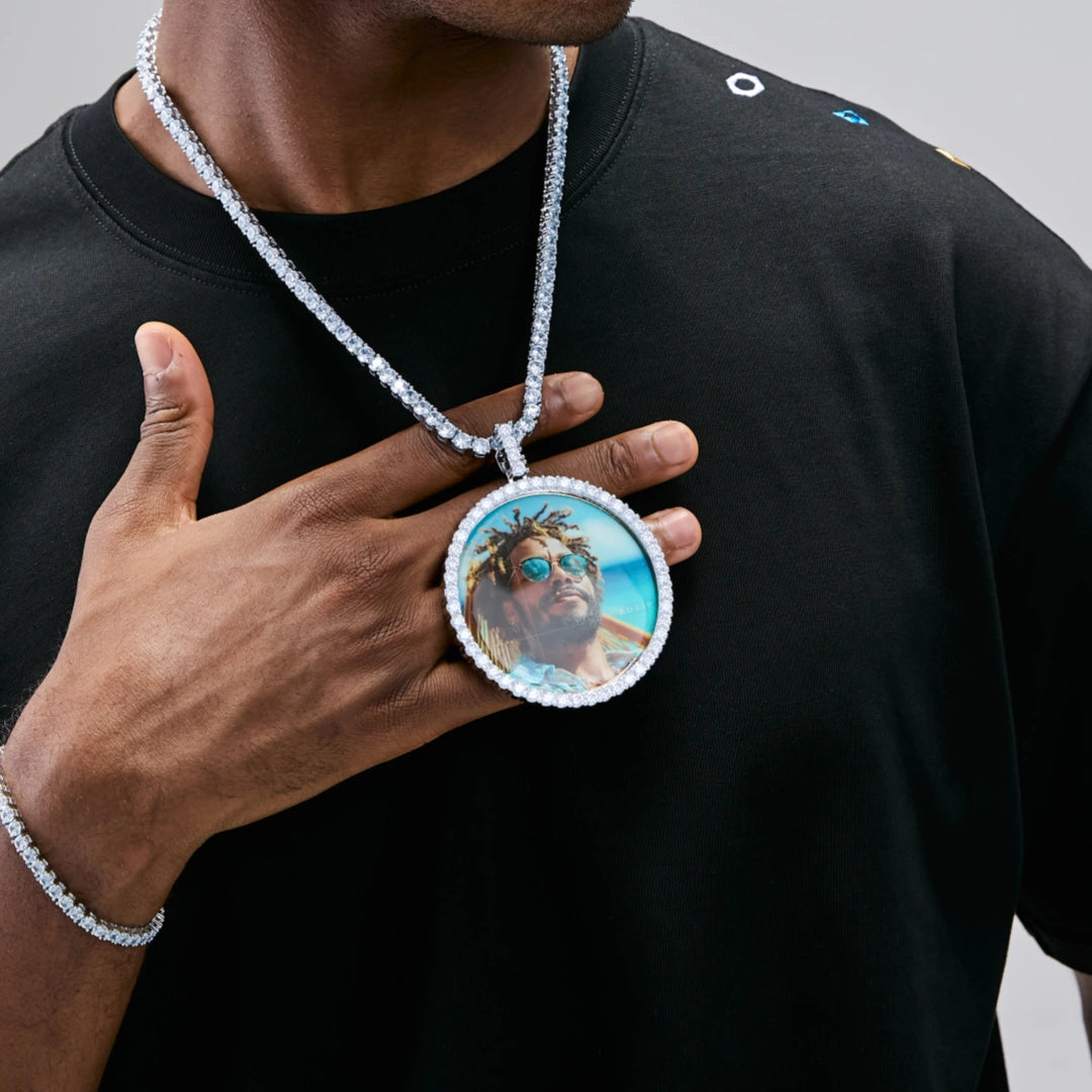 VVS MOISSANITE LARGE 3D CIRCLE CUSTOM PICTURE PENDANT, silver plated personalized custom portrait photo medallion, iced out hip hop necklace with tennis chain, lifestyle photo of male model wearing pendant with black streetwear shirt, RDRIP JEWELRY
