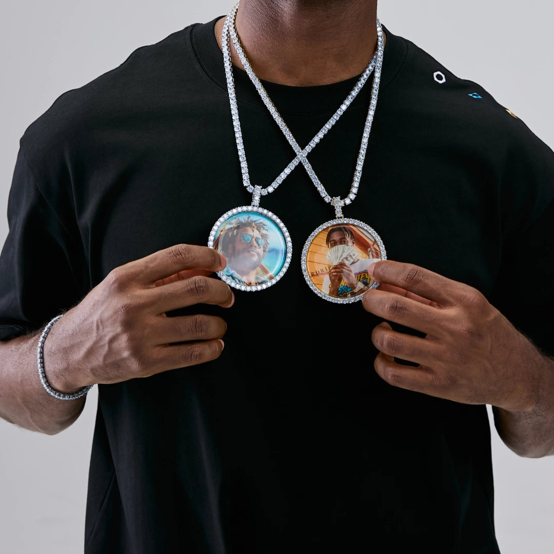 VVS MOISSANITE LARGE 3D CIRCLE CUSTOM PICTURE PENDANT, paired iced out round custom memory portrait photo medallions, personalized hip hop necklace set with tennis chains, lifestyle shot showing two different custom photo pendants worn by male model in black streetwear shirt, RDRIP JEWELRY
