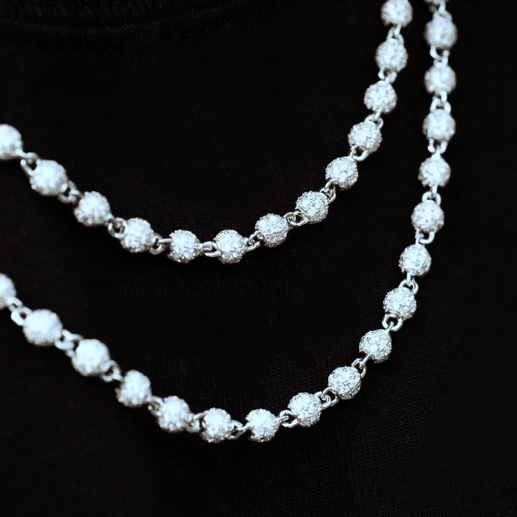 Close‑up detail shot of RDRIP 4mm Iced Stellar Ball Bead Chain on black fabric background, white gold plated hip hop men necklace, each round ball fully paved with flawless VVS simulated diamonds, showcase intricate bead link construction and brilliant sparkling effect, streetwear iced‑out fashion jewelry, RDRIP JEWELRY SINCE 2016
