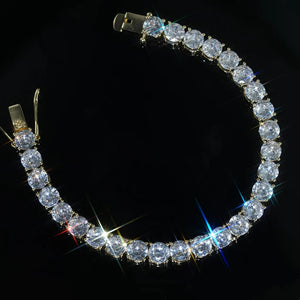 RDRIP 6mm 18k gold plated cubic zirconia tennis bracelet, full loop shot with brilliant starburst sparkle effect, premium VVS simulated diamond single row wrist chain, hand prong‑set iced‑out unisex hip‑hop bling jewelry, perfect for streetwear, party outfits and wrist stacking, available in 7‑8 inch wrist lengths RDRIP JEWELRY
