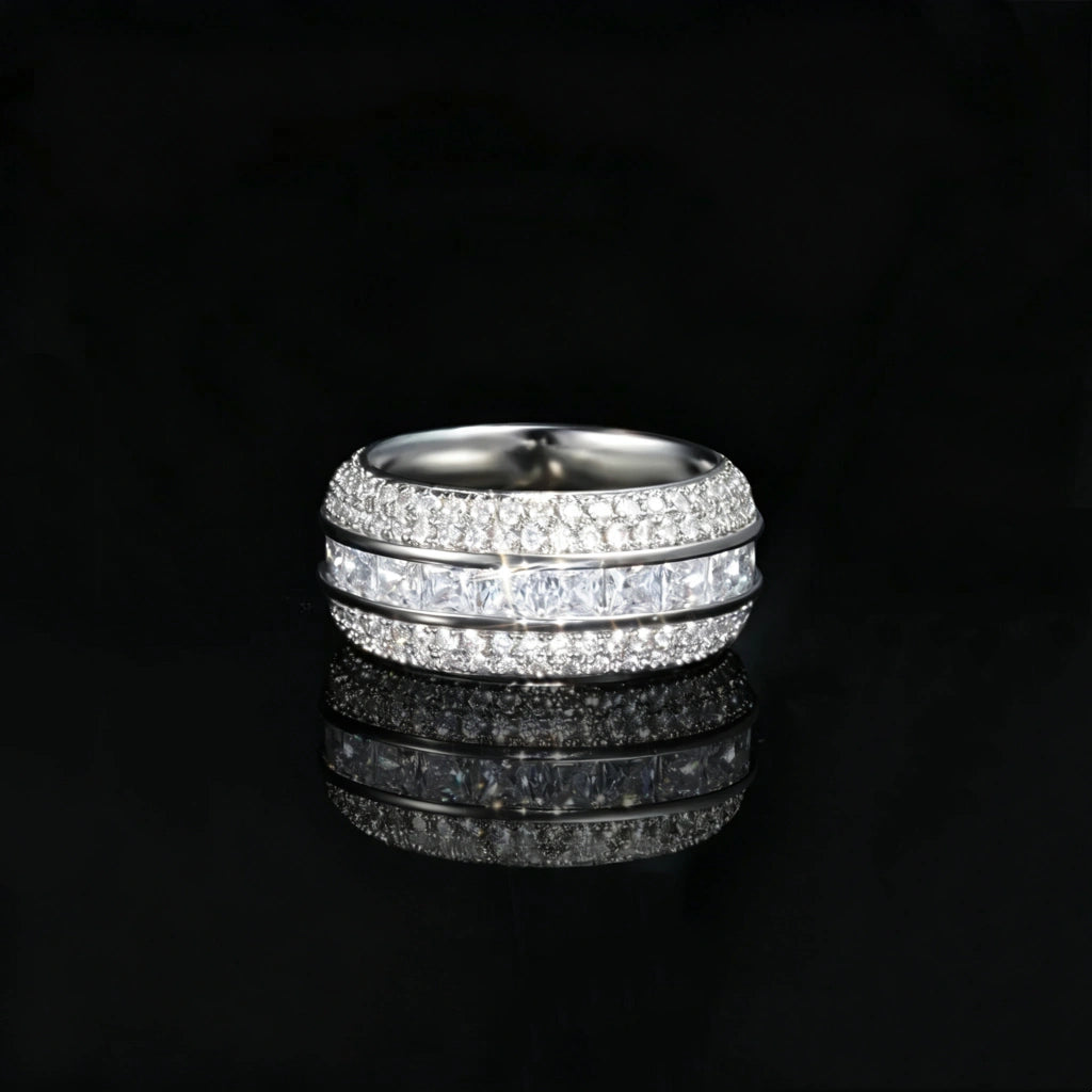 Front straight angle studio shot of silver tone baguette princess cut triple band spinner eternity ring for men, fully iced out with hand set aaa cubic zirconia micro pave stones, wide heavy hip hop statement band ring on glossy black reflective background, premium mens bling fashion jewelry RDRIP JEWELRY SINCE 2016
