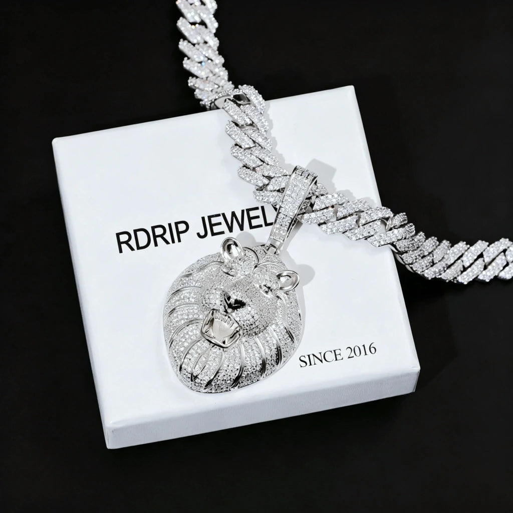 Silver tone iced out roaring king lion head pendant necklace, full pave flawless VVS simulated diamonds men hip hop bling jewelry laid on branded gift box pure black background RDRIP JEWELRY
