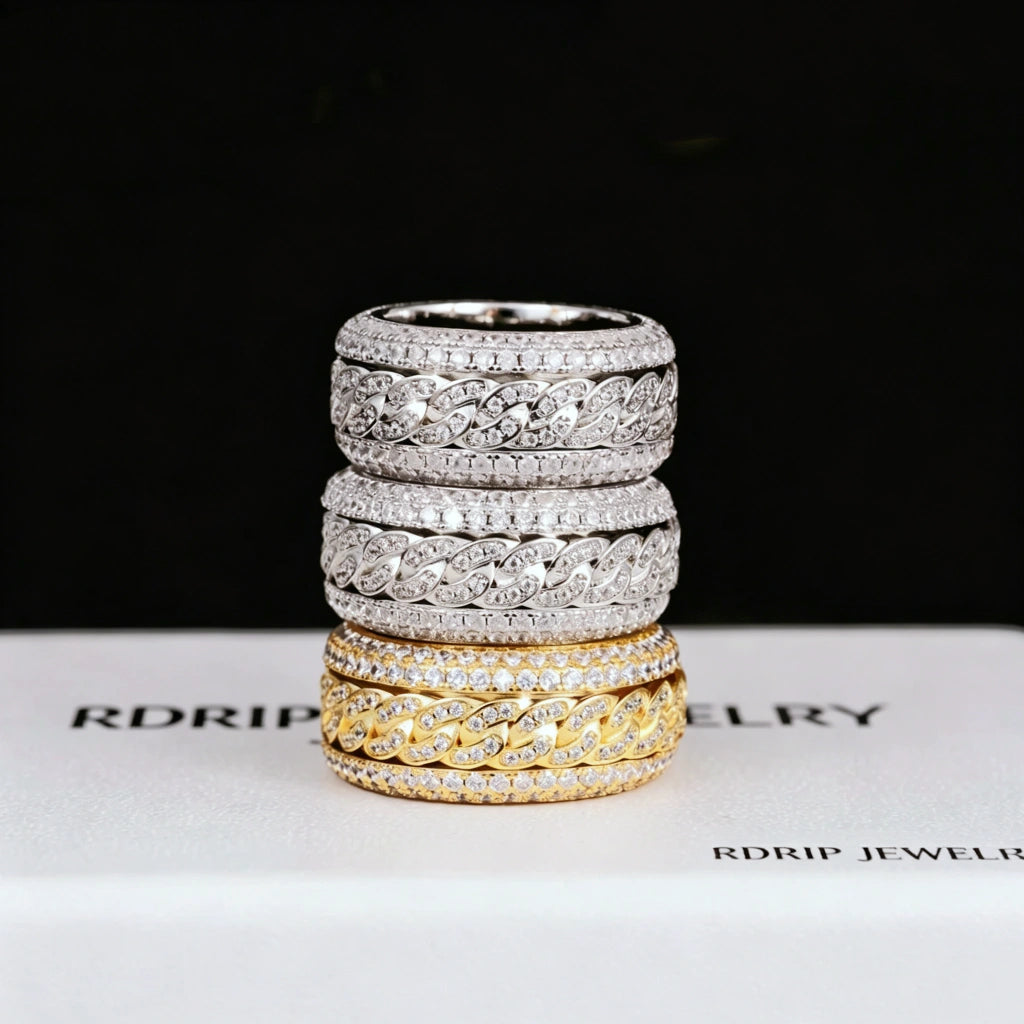 Stacked display of spinner 5‑layer iced cuban band rings, rotatable spinning cuban link wide band, hand‑set flawless VVS simulated diamonds, 18K gold plated and white gold plated heavy hip‑hop bling rings for men, 11mm width icy streetwear fashion jewelry collection RDRIP JEWELRY
