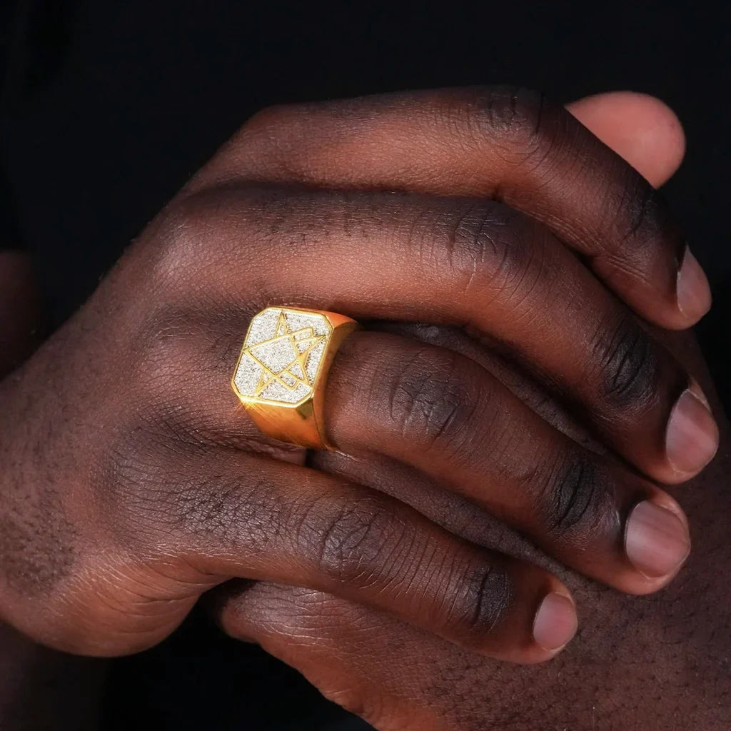 Men wearing RDRIP JEWELRY star of david hexagram iced cubic zirconia signet ring on hand, gold plated square hip hop bling ring with micro pave stones, street fashion men statement jewelry close‑up shot
