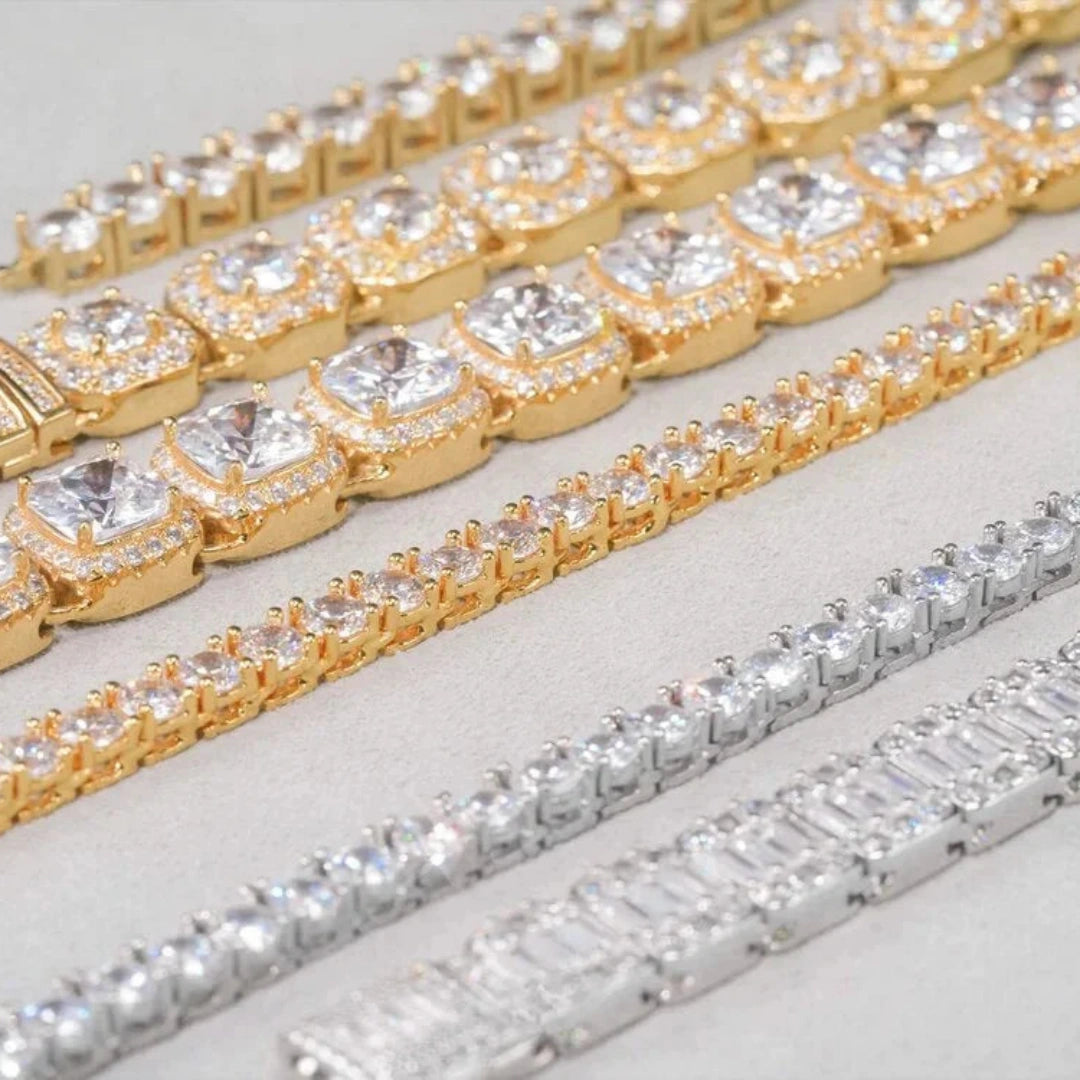 TENNIS CHAINS Collection close-up display, gold and white gold iced tennis necklaces with cushion & square cut diamond stones, multiple width hip hop bling tennis chain detail shot, RDRIP Jewelry
