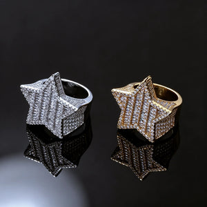 Two‑piece set of men heavy 3D micro‑pave pentagram star iced out rings, 18k gold plated and silver tone finishes, densely hand‑inlaid baguette cut and round cut AAA cubic zirconia stones, bulky hip‑hop rapper statement jewelry, both gold and silver color variants displayed side‑by‑side on black glossy reflective surface, luxury urban bling rings for men, RDRIP JEWELRY
