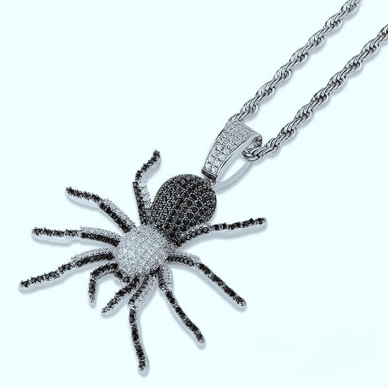 Angled close‑up view of two tone black and white iced tarantula spider pendant paired with silver rope chain, heavy micro pave black and clear VVS simulated diamonds, realistic spider hip hop charm necklace for men, isolated soft light background urban bling jewelry RDRIP JEWELRY
