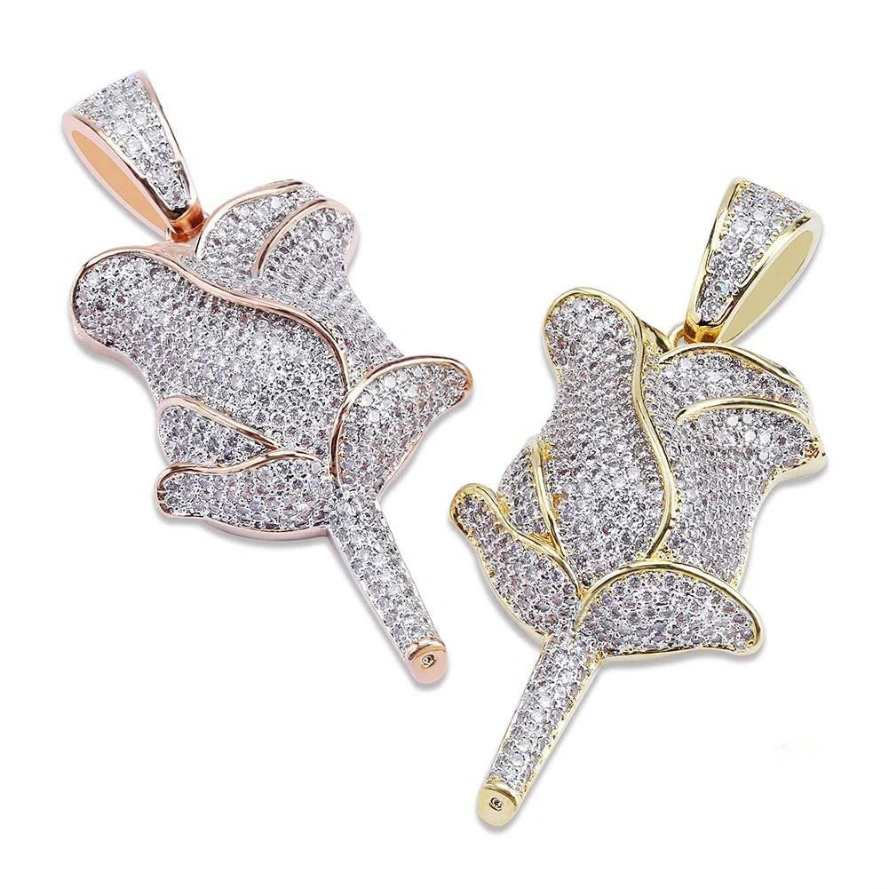 Side by side comparison of two iced out bling fully paved rose flower pendants, gold tone and rose gold tone finish covered with flawless vvs simulated diamonds, closeup view of hip hop rose charm pendants for unisex streetwear RDRIP JEWELRY SINCE 2016
