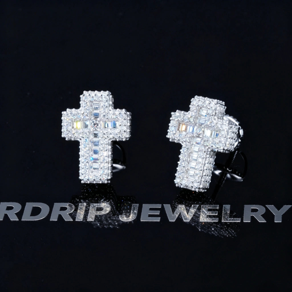 VVS1 Moissanite Baguette Cross Stud Earrings on reflective black display board, iced out full pave mixed baguette and round moissanite cross earrings, secure screw back setting, 925 sterling silver white gold plated unisex hip hop jewelry RDRIP JEWELRY
