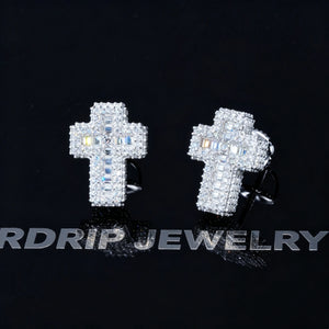 VVS1 Moissanite Baguette Cross Stud Earrings on reflective black display board, iced out full pave mixed baguette and round moissanite cross earrings, secure screw back setting, 925 sterling silver white gold plated unisex hip hop jewelry RDRIP JEWELRY
